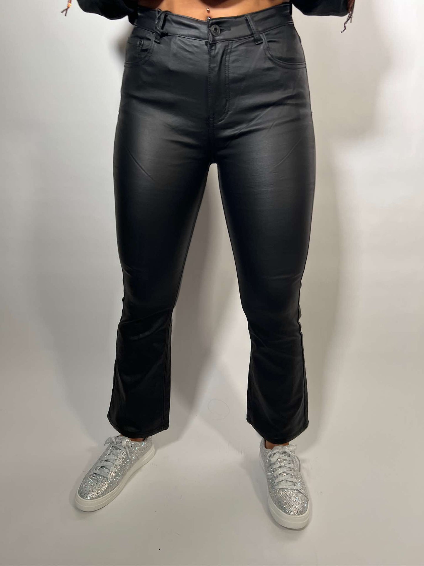 Stretch faux leather flare pants in black