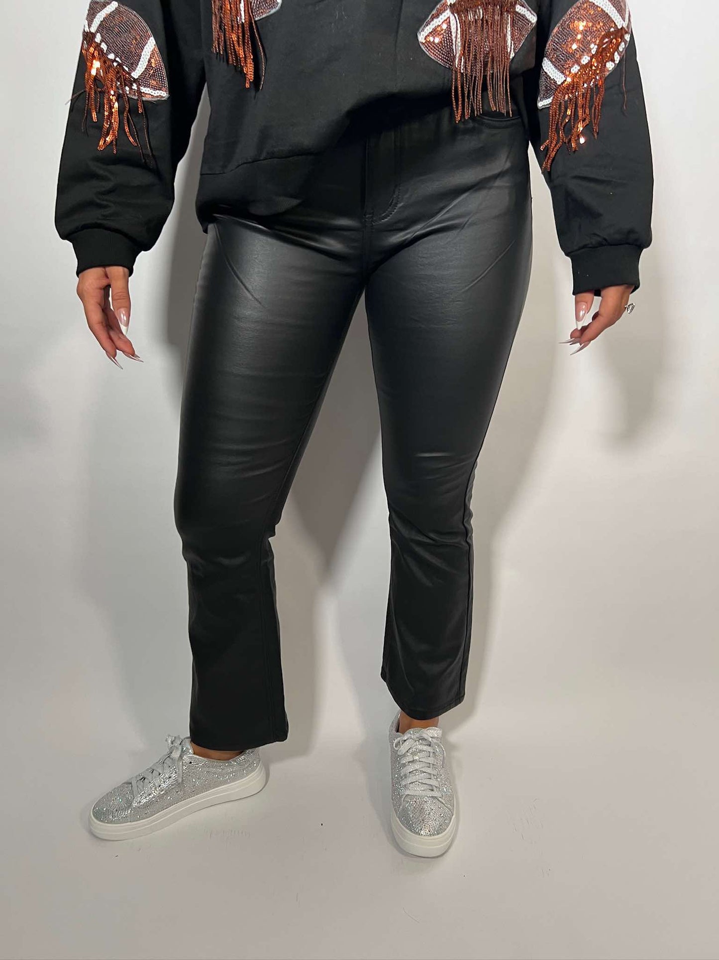 Stretch faux leather flare pants in black